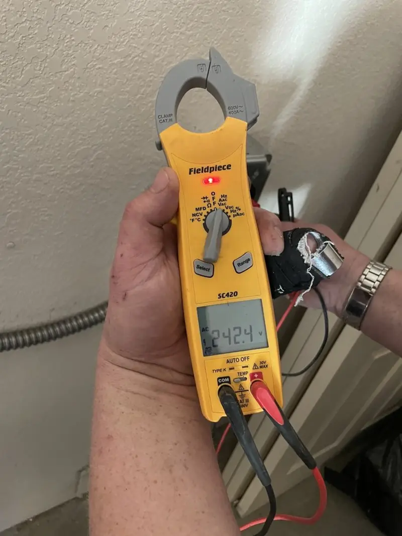 Voltage testing with clamp meter during Whole House Surge Protector in Avon Lake